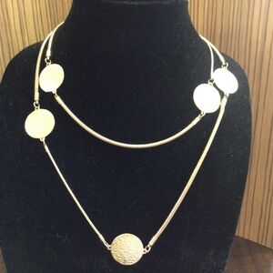 Long goldtone  disc necklace. Signed NY  Great shape